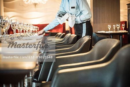 Waitress setting table
