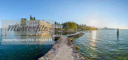 Locanda San Vigilio with harbor at sunrise in Punta San Vigilio in Garda on Lake Garda in Veneto, Italy