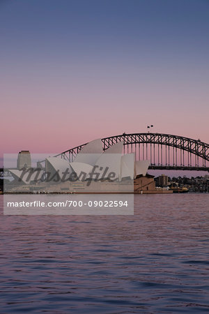 Sydney Opera House and the Sydney Harbour Bridge at sunrise in Sydney, Australia