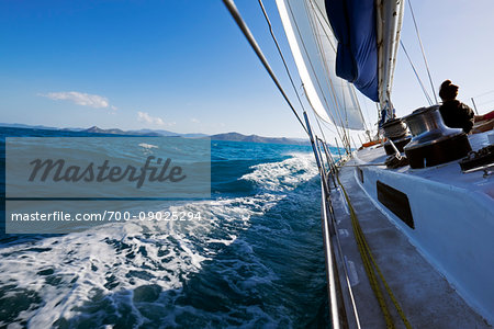 Sailing on the waves of the Coral Sea around the Whitsunday Islands in Queensland, Australia