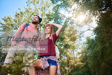 Low angle view of couple hiking, looking away, Krakow, Malopolskie, Poland, Europe