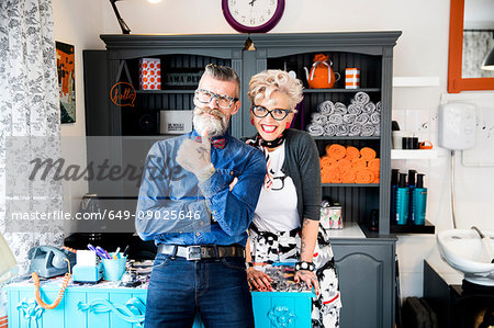 Couple in vintage clothes in quirky hair salon