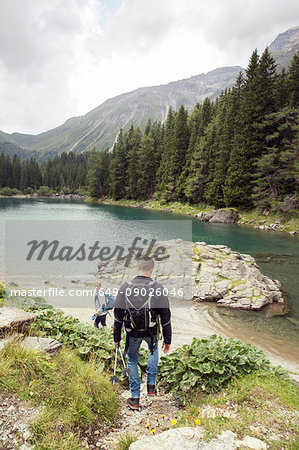 Couple hiking by lake, Tirol, Steiermark, Austria, Europe