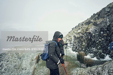 Hikers on mountain, Coniston, Cumbria, United Kingdom