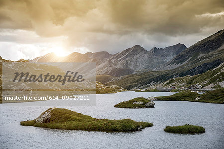 Lake by mountains at sunset, San Bernardino, Ticino, Switzerland, Europe