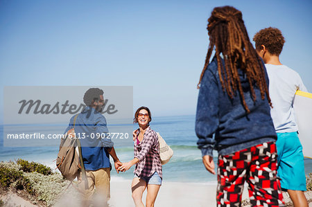 Multi-ethnic family on sunny summer ocean beach