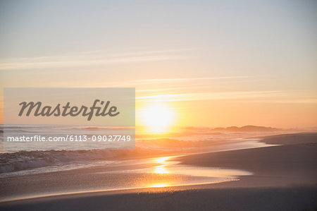 Tranquil sunset view over ocean beach Tranquil sunset view over ocean beach