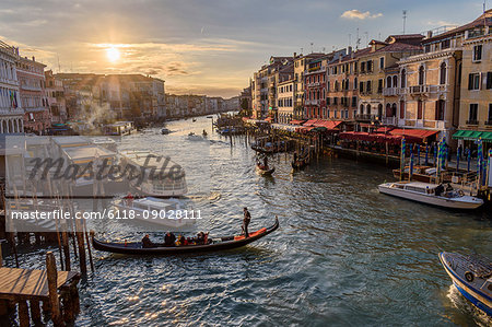 Gondolas moored on a canal lined with historic houses, Venice, Italy.