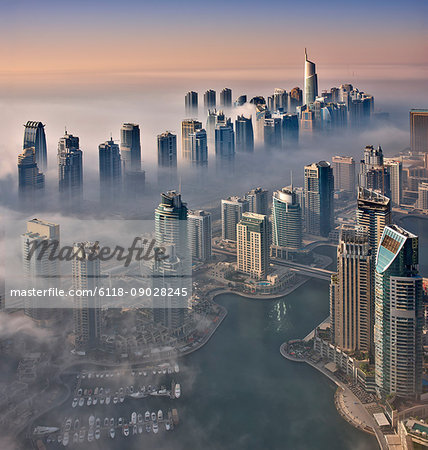 Aerial view of the cityscape of Dubai, United Arab Emirates, with the marina in the foreground.
