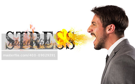 Businessman burns the word stress. stressed business life concept