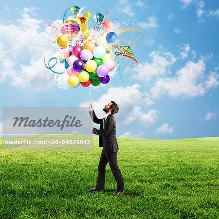 Creative businessman holding a creative colorful balloons