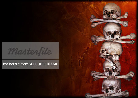 Grunge background with human skulls, bones and old stucco wall texture. Copy space for your text