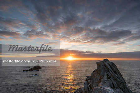 Vieille lighthouse from Raz point at sunset. Plogoff, Finistère, Brittany, France.