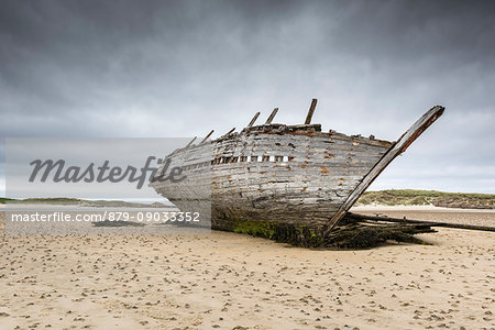 Wrecked ship on Magheraclogher sand beach. Bunbeg, Co. Donegal, Ireland.