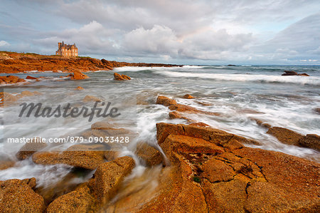 Turpault castle, Morbihan, Brittany, France. The wild coast of Quiberon peninsula and Turpault chateau in a cloudy day