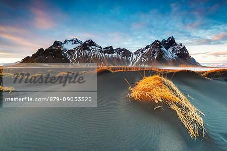 Stokksnes, Hofn, East Iceland, Iceland. Vestrahorn mountain and the black sand dunes at sunset.