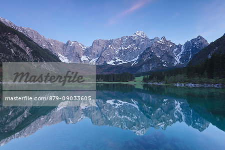 Europe, Italy, Friuli Venezia Giulia. Dusk at the Fusine upper lake with the Mangart mount on background