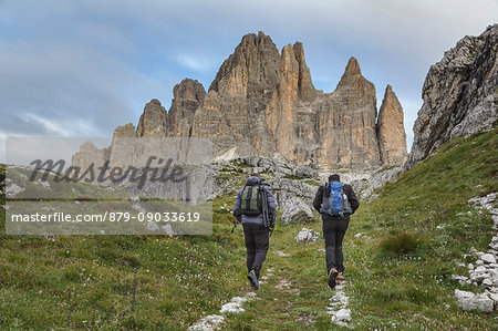 Europe, Italy, Veneto, Belluno. Hikers on a path near Tre Cime di Lavaredo south side, Dolomites