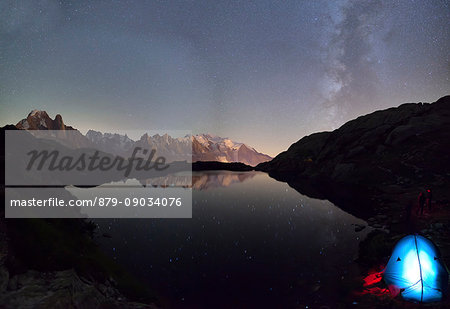Camping under the stars at Lac du Cheserys. In the background the range of Mont Blanc. Haute Savoie. France