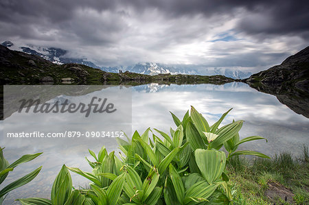 Clouds reflected in Lac de Cheserys Chamonix Haute Savoie France Europe