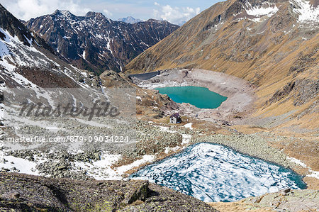 View of Lago Rotondo during thaw and Lake Baitone Val Malga Adamello Regional Park province of Brescia Lombardy Italy Europe