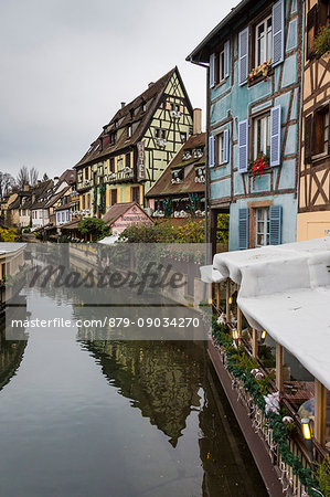 Colored houses reflected in river Lauch at Christmas time Petite Venise Colmar Haut-Rhin department Alsace France Europe