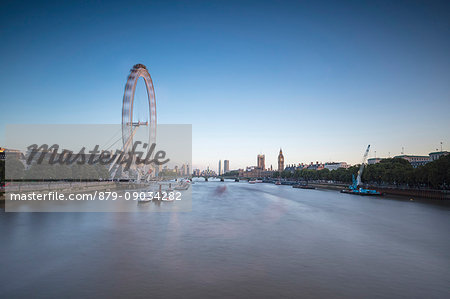 View of River Thames with London Eye the Big Ben and Westminster Palace in background at dusk London United Kingdom