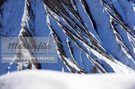 Details of the rocky crest of mountains covered with snow Langwies district of Plessur Canton of Graubünden Switzerland Europe