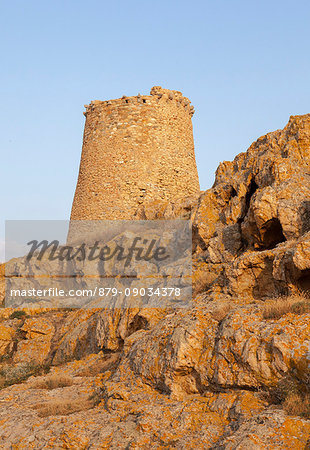 The ancient Genoese tower built as fortress with granite rocks at sunset Ile Rousse Balagne Region Corsica France Europe