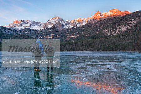 Frozen lake Tovel at sunrise Europe, Italy, Trentino Alto Adige, Trento district, Non valley, Tovel valley, Tuenno city