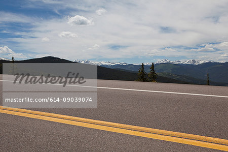 Squaw Pass highway and distant mountains, Evergreen, Colorado, USA