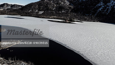 Aerial view of an ice floe in a fjord, the Arctic scenery and conditions  in Lofoten Islands, Norway.