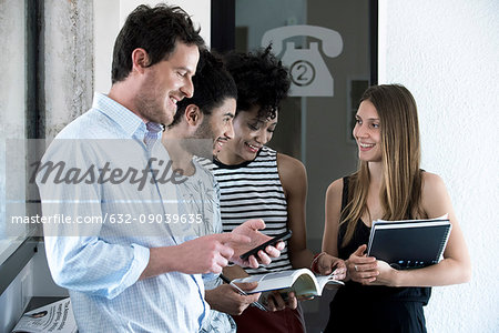 Group of friends standing around chatting