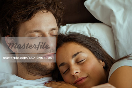 Couple sleeping in bed