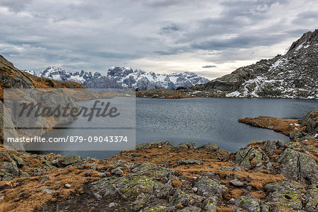 Italy, Trentino Alto Adige, Adamello Brenta Park, Nambrone valley, Black lake with Brenta dolomites in backgroud in a cloud day.