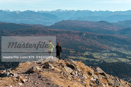 Italy, Trentino Alto Adige, Non valley, two women hikers descend from the top of Luco Mount.