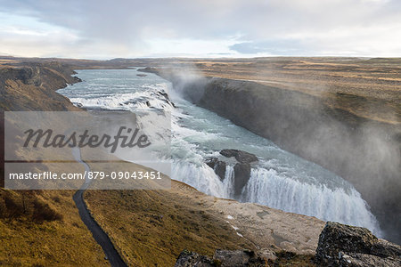 Landscape with Gullfoss waterfall, steam and road. Hrunamannahreppur, Arnessysla, Sudurland, Iceland, Europe.