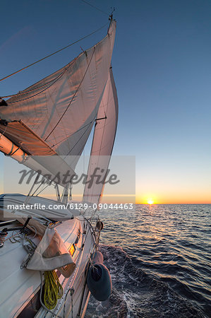 Sailing during the sunrise (Cote d'Azur, Alpes-Maritimes department, Provence-Alpes-Cote d'Azur region, France, Balearic Sea, Mediterranean Sea, Europe)