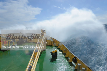 Bow of the icebreaker cruise ship, Kapitan Khlebnikov, on the way to Ushuaia, Argnetina with waves crashing from the rough seas of the Drake Passage in the Southern Atlantic Ocean between South America and Antartica