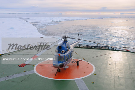 Helicopter on deck of the icebreaker cruise ship, Kapitan Khlebnikov at Snow Hill Island in the Weddel Sea in the morning sunlight, Antarctic Peninsula, Antarctica