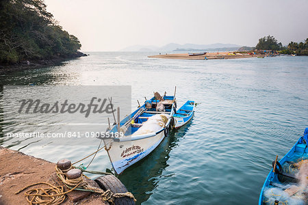 Fishing boats in a port at Talpona Beach, South Goa, India, Asia