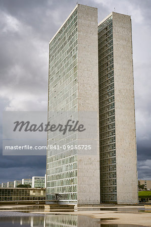 Twin towers of the National Congress designed by Oscar Niemeyer, 1958, at the heart of the Pilot Plan, with Ministries in the background, Brasilia, UNESCO World Heritage Site, Brazil, South America