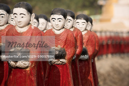 Rakhine state, Myanmar. Monks statues lined up in a pagoda.