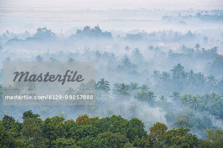 Mrauk-U, Rakhine state, Myanmar. Mrauk-U valley in a foggy sunrise seen from the Shwetaung pagoda.