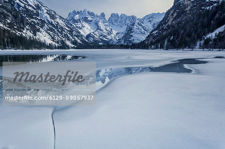 Europe, Italy, South Tyrol, Bolzano. The Landro lake with the peaks of mount Cristallo reflected in the water.