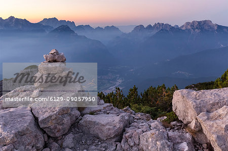 Europe, Italy, Veneto, Belluno. Sunrise from the First Pala di San Lucano summit towards Agordo. Agordino, Dolomites