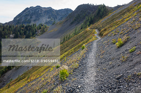 Hiking trail in the North Cascades, Pacific Crest Trail through pristine alpine wilderness, autumn, near Granite Pass, Pasayten Wilderness, Okanogan National Forest, Washington.