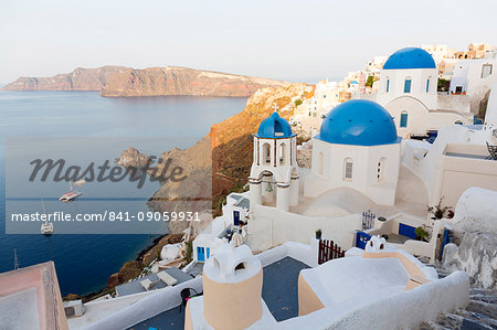 Classic view of the village of Oia with its blue domed churches and colourful houses, Oia, Santorini, Cyclades, Greek Islands, Greece, Europe Classic view of the village of Oia with its blue domed churches and colourful houses, Oia, Santorini, Cyclades, Greek Islands, Greece, Europe