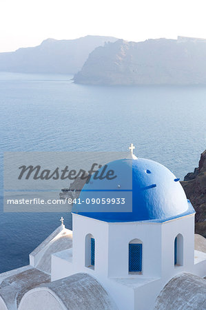 White church with blue dome overlooking the Caldera, Oia, Santorini, Cyclades Islands, Greek Islands, Greece, Europe