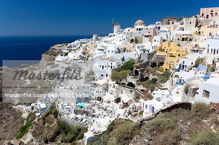 Classic view of the village of Oia with its windmill and whitewashed houses, Oia, Santorini, Cyclades, Greek Islands, Greece, Europe